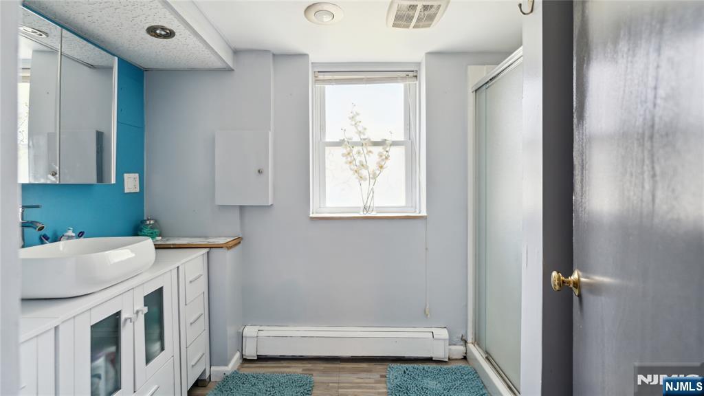 80 Union Avenue Little Ferry, NJ 07643 - Photo 18 of 35 a bathroom with a sink a toilet and vanity