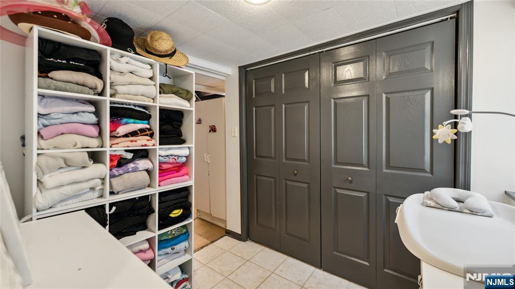 80 Union Avenue Little Ferry, NJ 07643 - Photo 19 of 35 a bedroom with a bed and a dresser