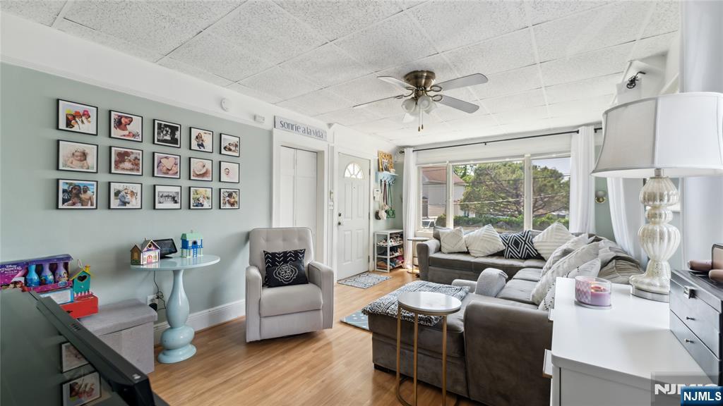 80 Union Avenue Little Ferry, NJ 07643 - Photo 2 of 35 a living room with furniture and a window