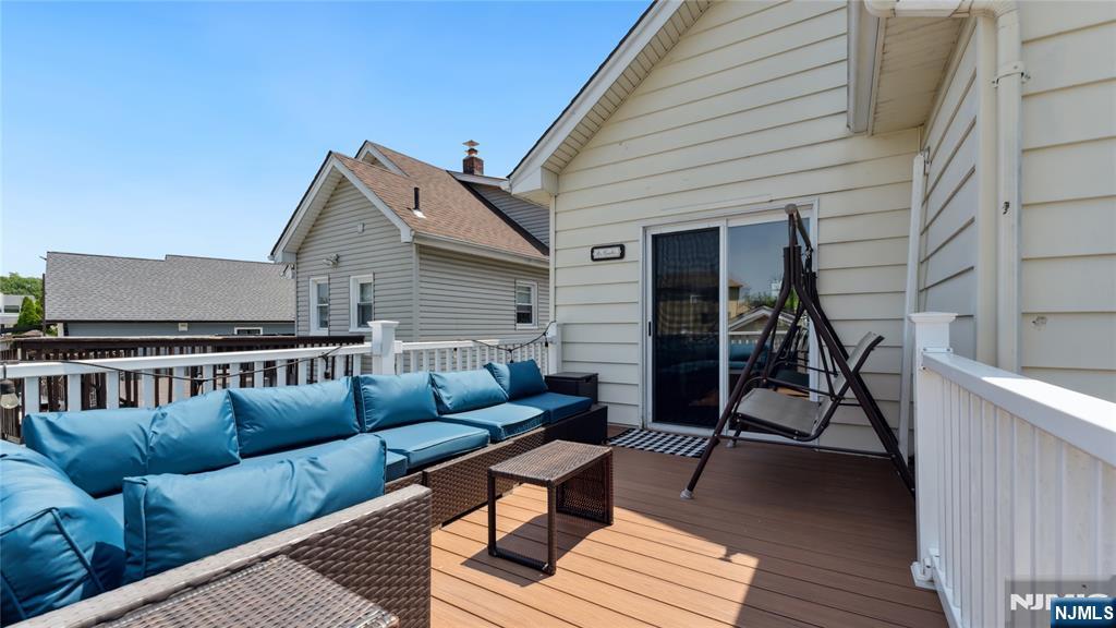 80 Union Avenue Little Ferry, NJ 07643 - Photo 32 of 35 a view of a patio with couches and a potted plant on a table