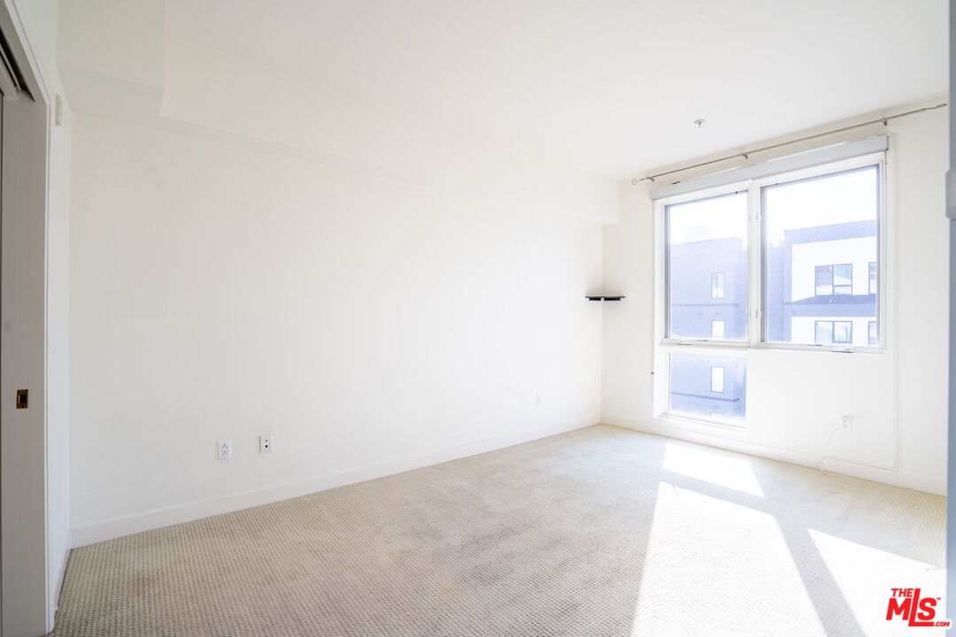 1234 Wilshire Boulevard, Unit 517 Los Angeles, CA 90017 - Photo 11 of 17 a view of an empty room with a window