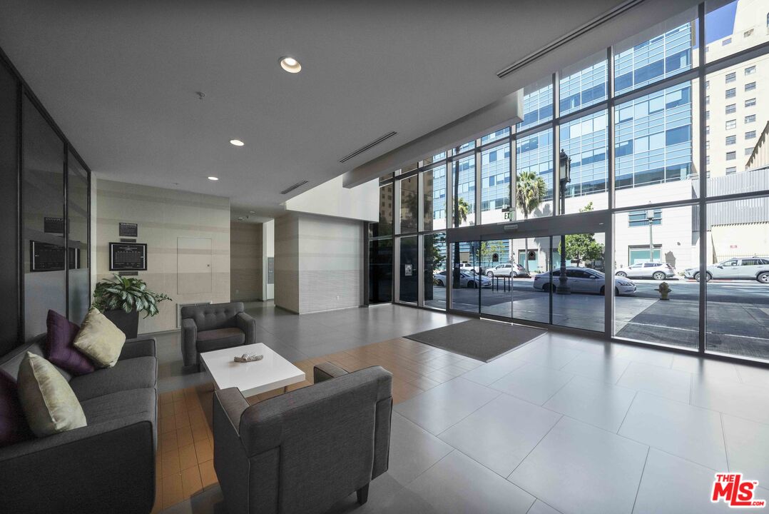 1234 Wilshire Boulevard, Unit 517 Los Angeles, CA 90017 - Photo 13 of 17 a living room with furniture