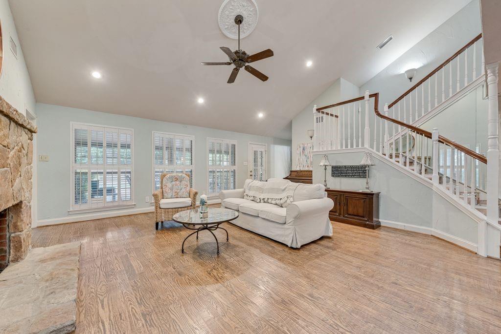 2 Eastshore Road Heath, TX 75032 - Photo 4 of 30 a living room with furniture and a table with wooden floor