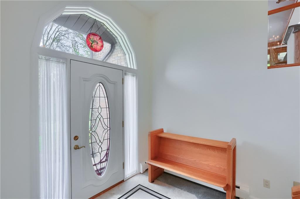 481 Chicora Fenelton Road Chicora, PA 16025 - Photo 6 of 50 Welcoming foyer with soaring ceiling, decorative entry door, and bright natural light.
