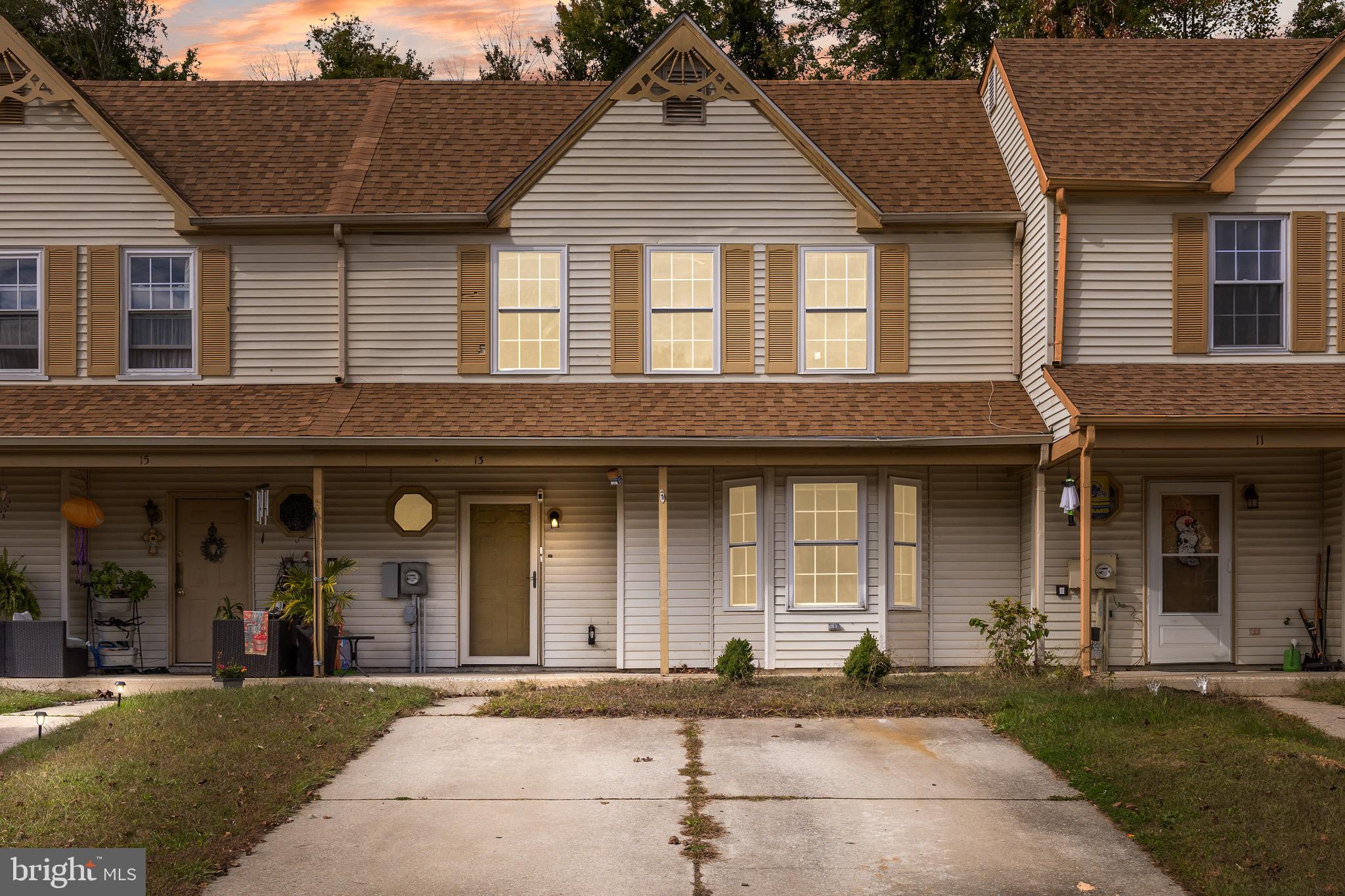 13 Summit Court Clementon, NJ 08021 - Photo 1 of 6 a front view of a house with a garden