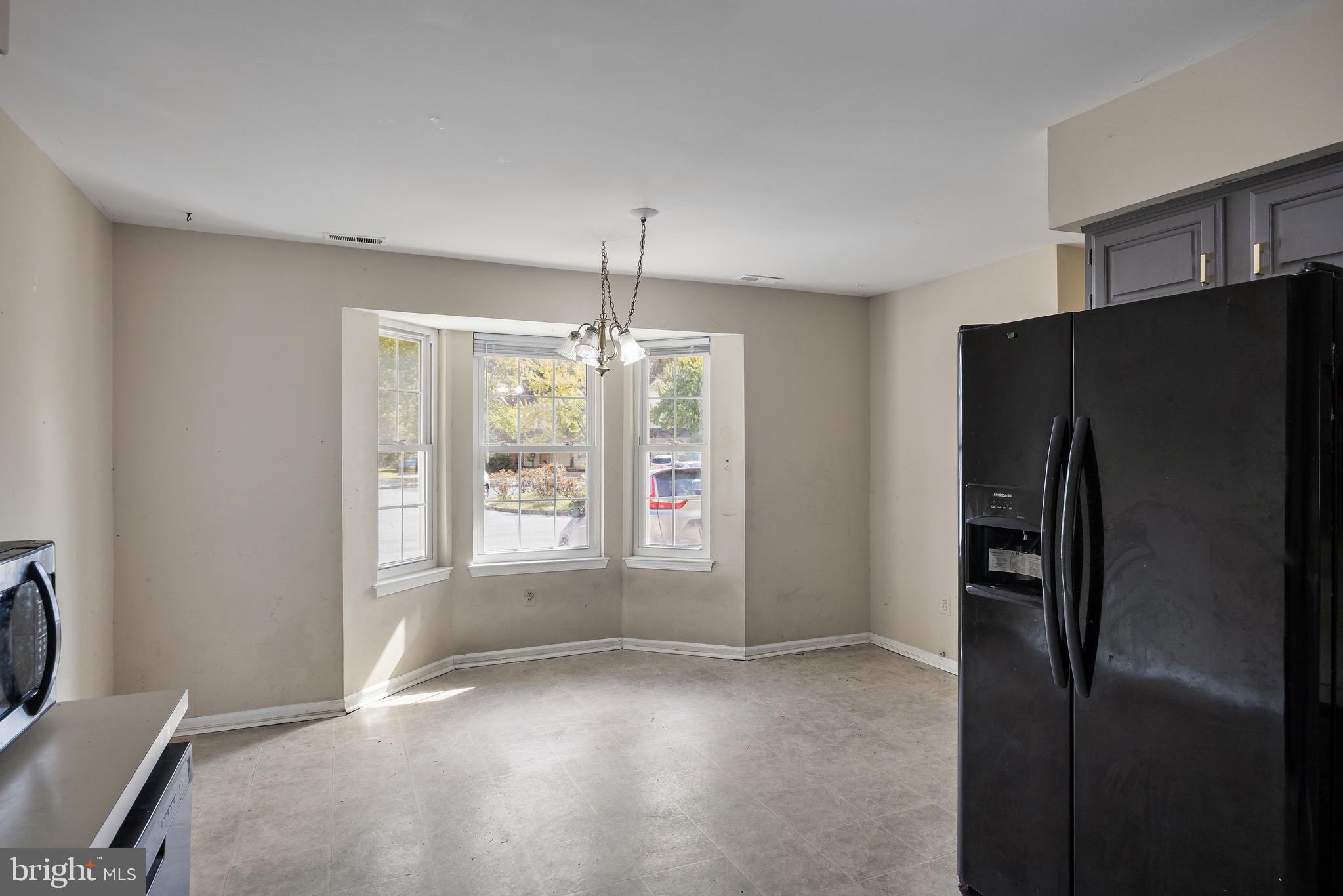 13 Summit Court Clementon, NJ 08021 - Photo 6 of 6 a view of an empty room with window and refrigerator
