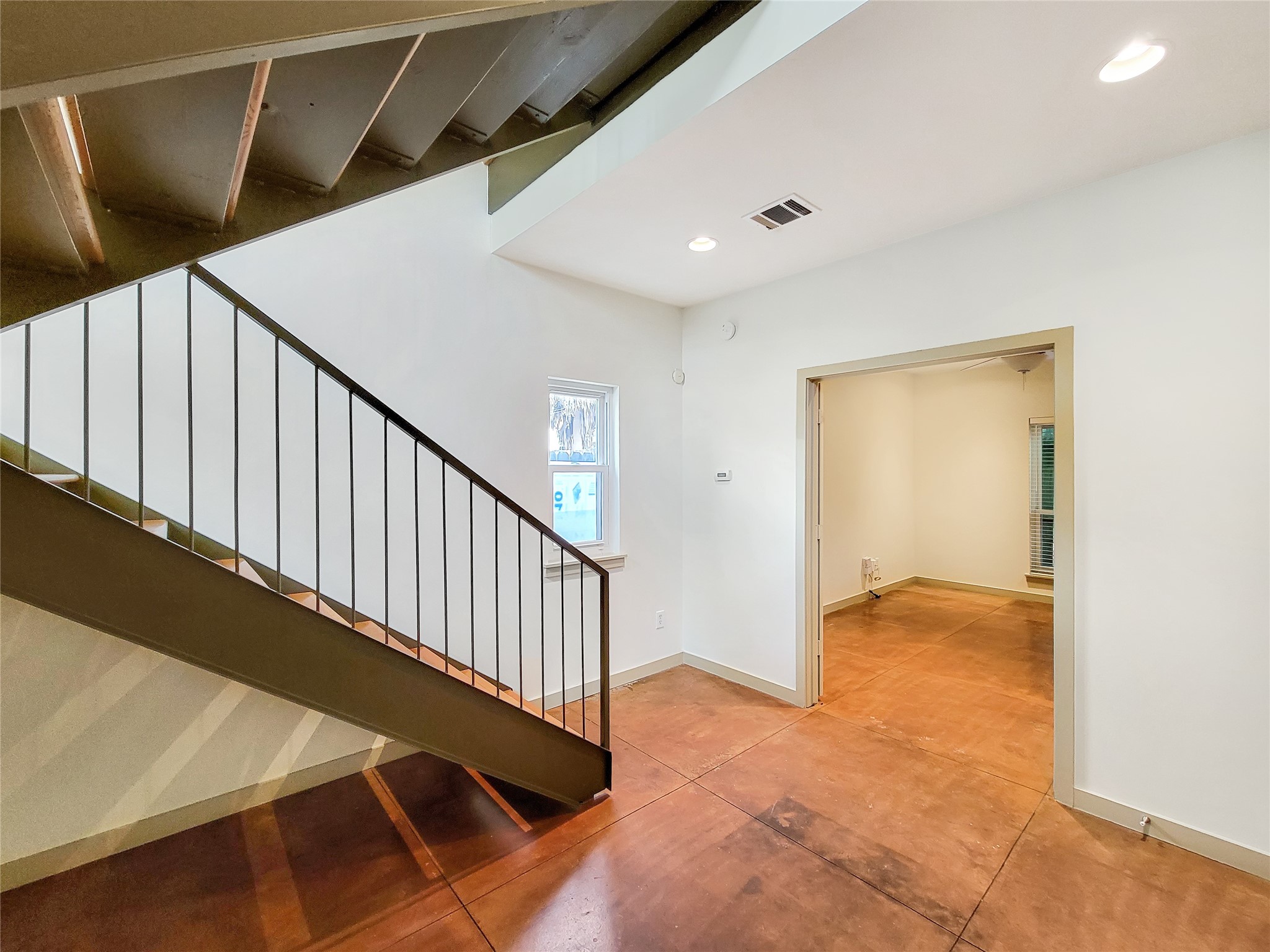 321 East 20th Street Houston, TX 77008 - Photo 16 of 36 The loft style architecture features open stairs made of steel and wood.