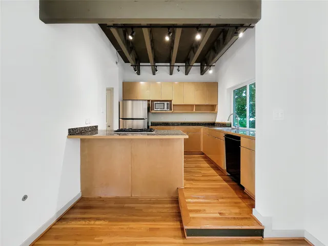 a view of a kitchen with an entryway