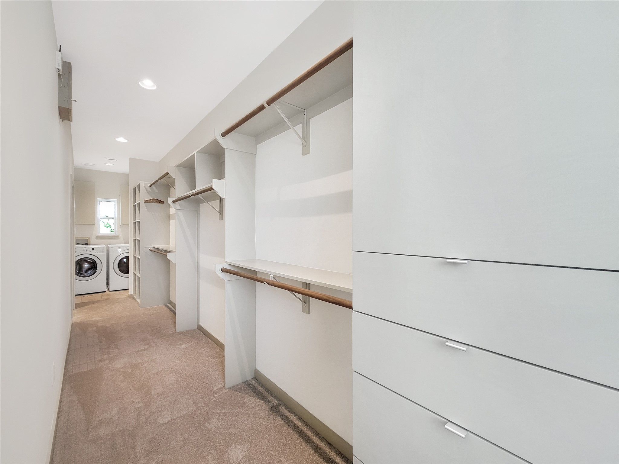 321 East 20th Street Houston, TX 77008 - Photo 8 of 36 The primary walk-in closet is immense and contains a laundry area. W/D included!