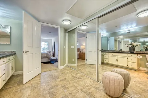 a spacious bathroom with a sink and a mirror