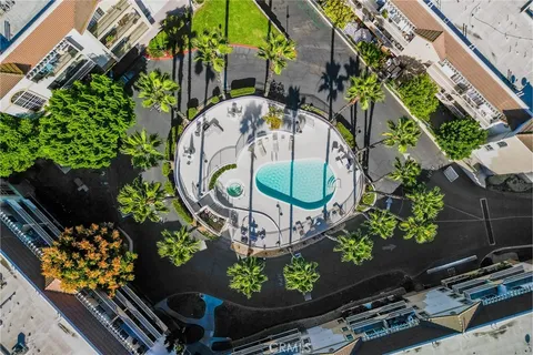 a view of a wooden deck with chairs and a yard