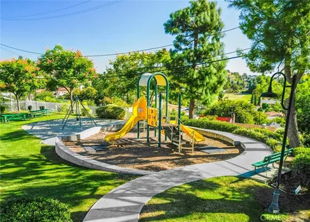an aerial view of residential houses with city view