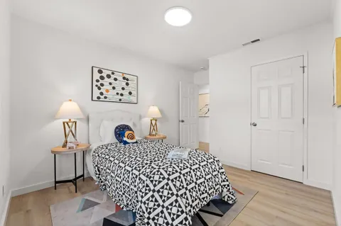 a kitchen with a white cabinets and white appliances