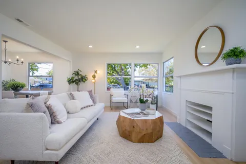a kitchen with a sink a stove and cabinets