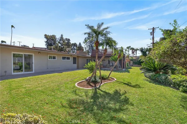 a house view with a garden space
