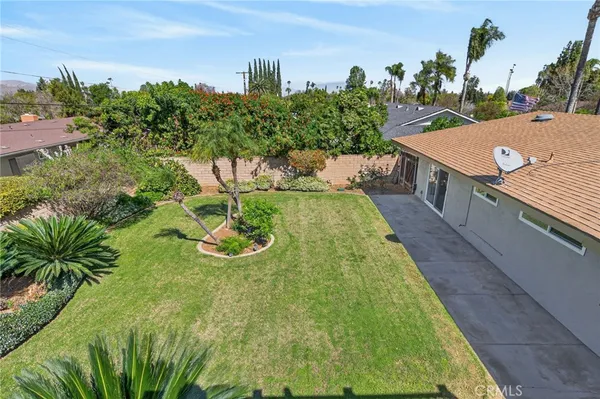 a view of a swimming pool with a yard