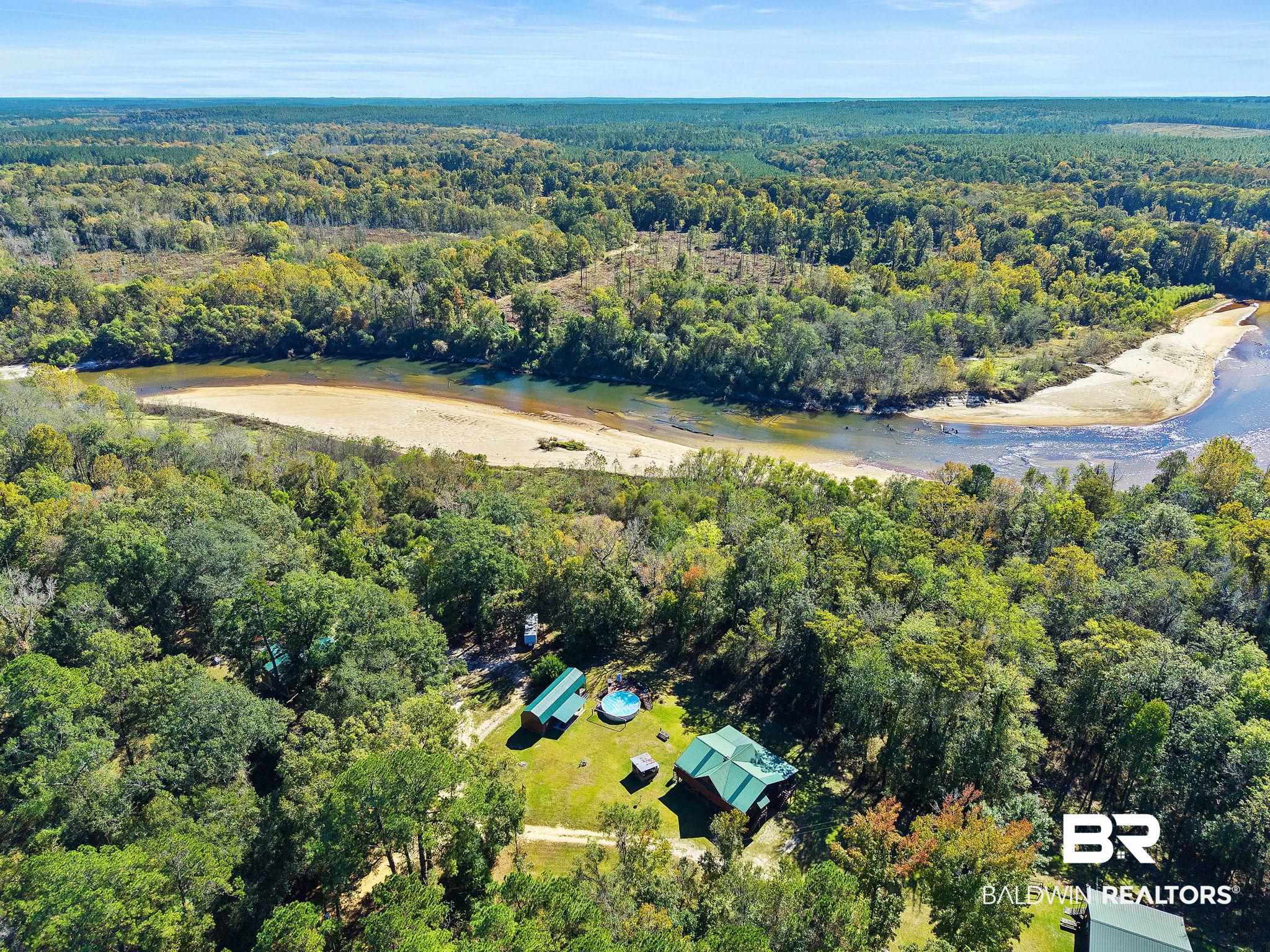 724 Rowell Lane Brewton, AL 36426 - Photo 39 of 40 Aerial view of property's location with a forest and a nearby body of water