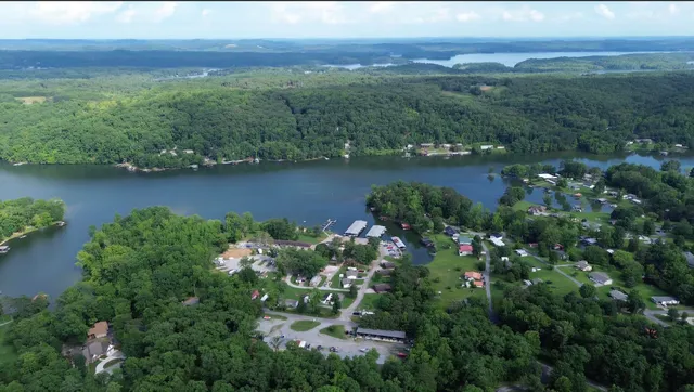 an aerial view of a houses with a yard