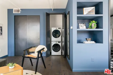 a view of a hallway with washer and dryer
