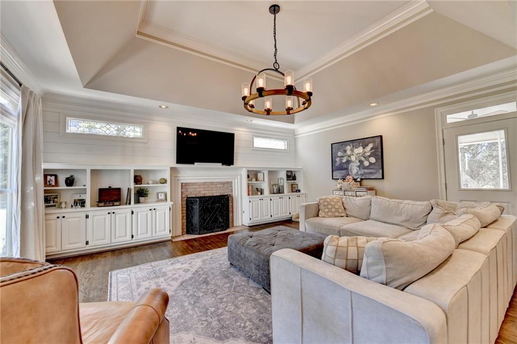 2853 Brookside Drive Monroe, GA 30656 - Photo 14 of 76 a living room with furniture a fireplace and a flat screen tv