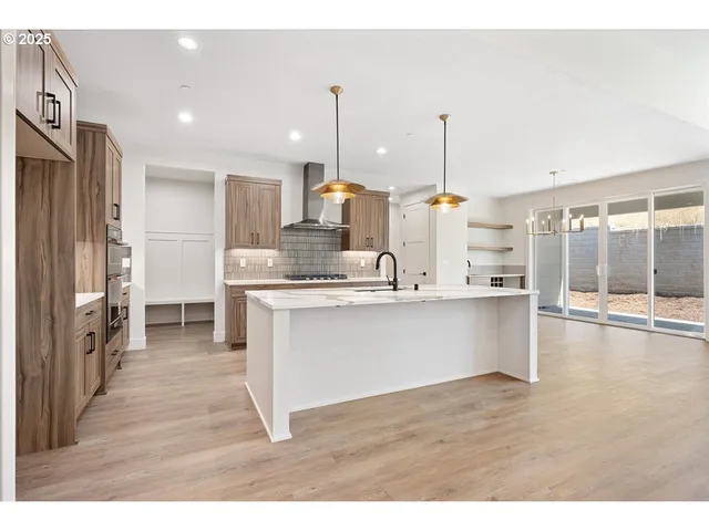 a view of kitchen with wooden floor