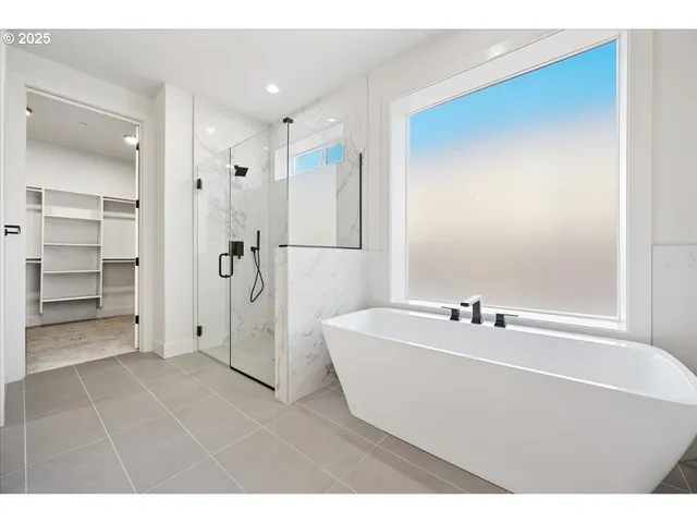 a bathroom with a bathtub and a sink