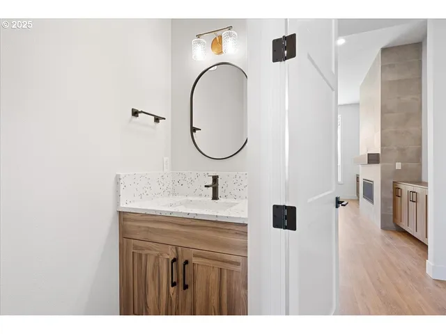 a bathroom with a sink and a mirror