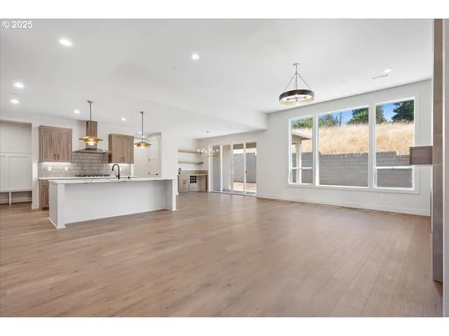 a view of kitchen with wooden floor and windows