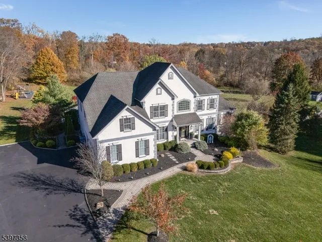an aerial view of a house with garden