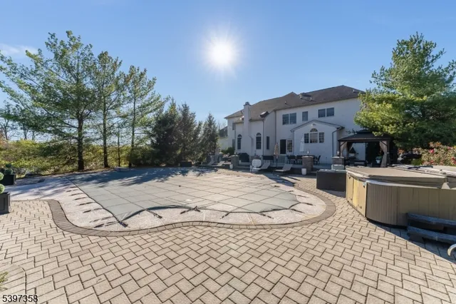 a view of a patio with a table and chairs