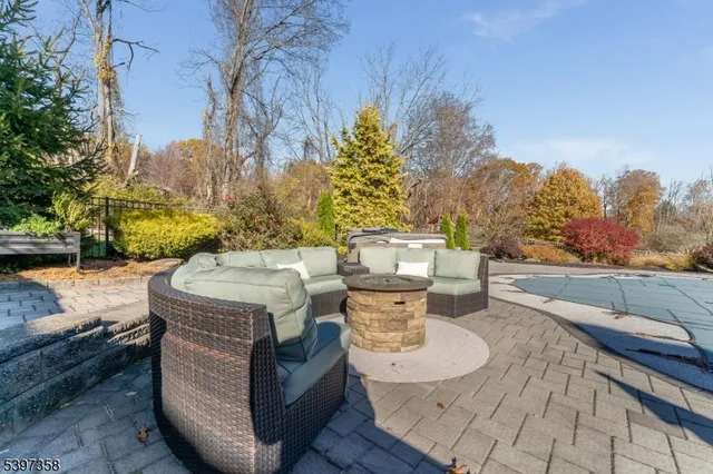 a view of a patio with table and chairs