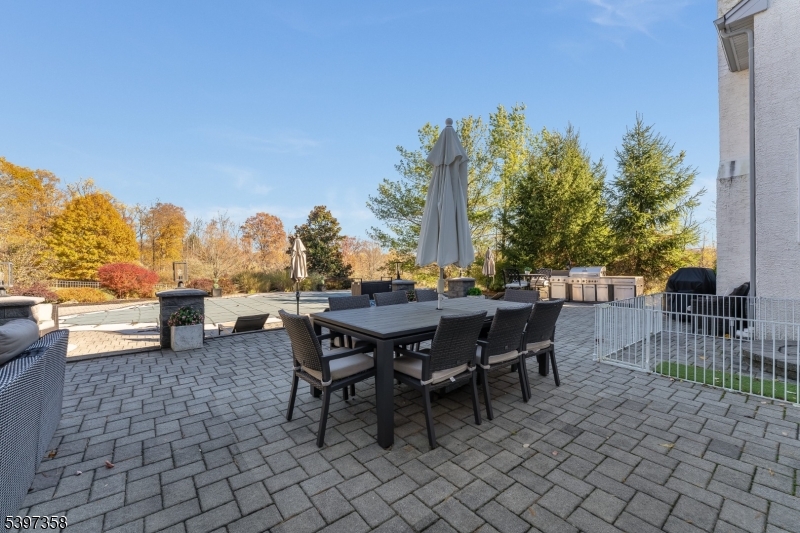 16 Perry Road Annandale, NJ 08801 - Photo 17 of 49 a view of a patio with a table and chairs