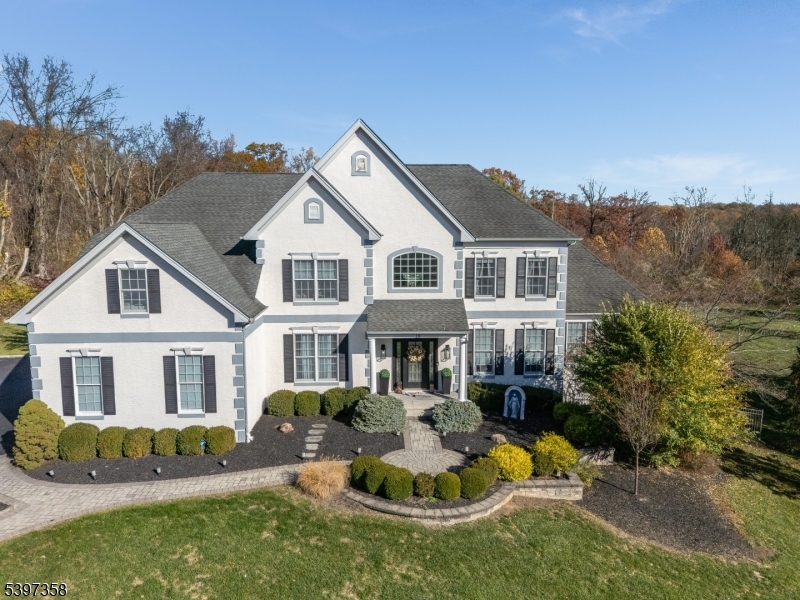 16 Perry Road Annandale, NJ 08801 - Photo 2 of 49 a front view of a house with a yard table and chairs