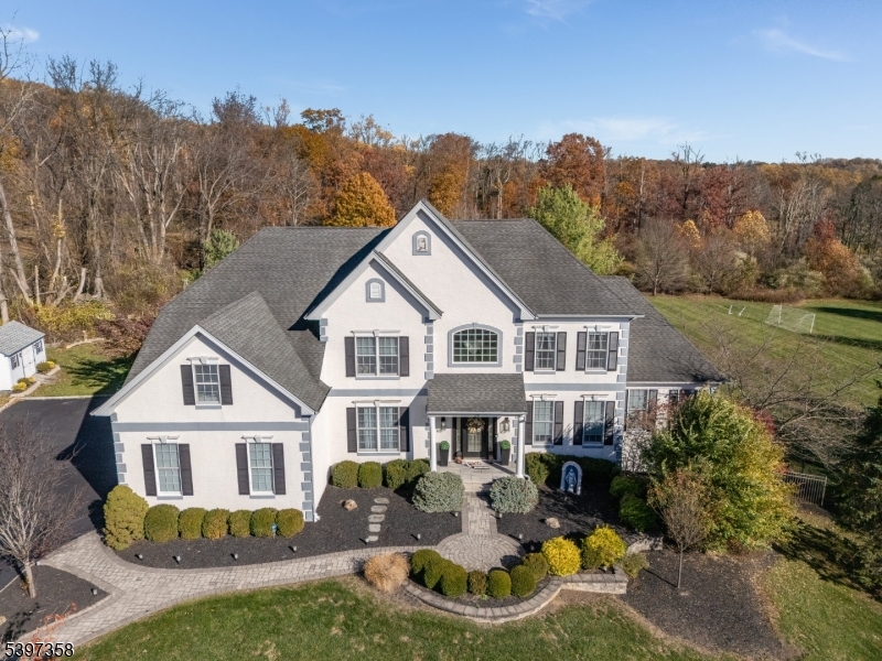 16 Perry Road Annandale, NJ 08801 - Photo 25 of 49 a front view of a house with a yard fire pit and outdoor seating