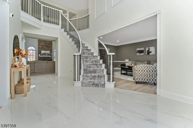 a bedroom with furniture and a flat screen tv