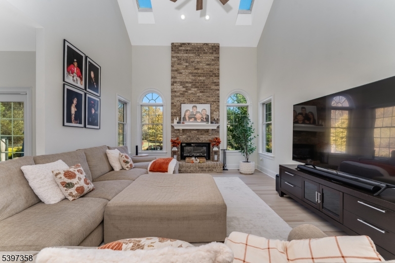 16 Perry Road Annandale, NJ 08801 - Photo 27 of 49 a living room with furniture and a flat screen tv