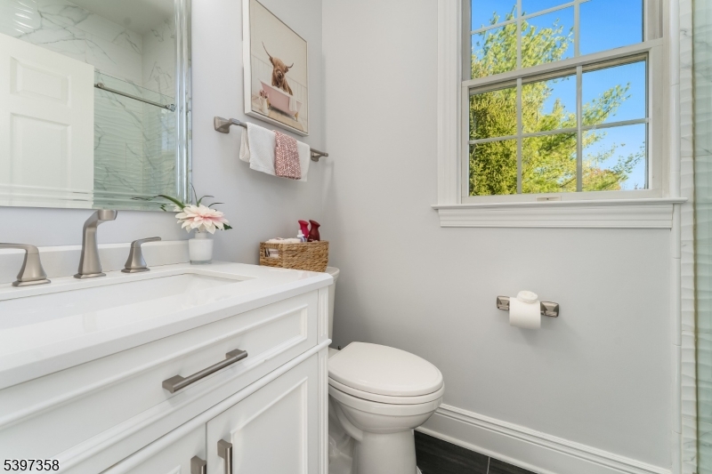 16 Perry Road Annandale, NJ 08801 - Photo 37 of 49 a bathroom with a sink a toilet and a mirror