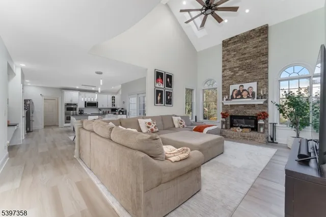 a living room with furniture and fireplace