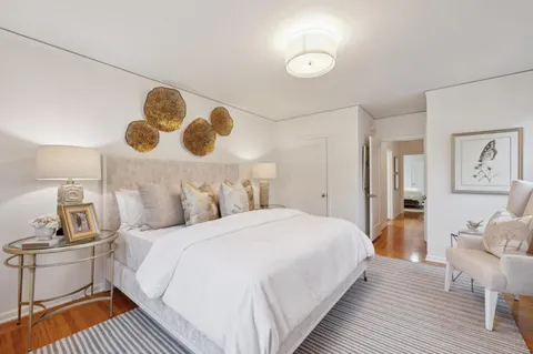 a bedroom with a large bed and a window