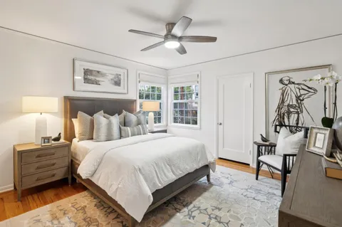 a bedroom with bed and a window