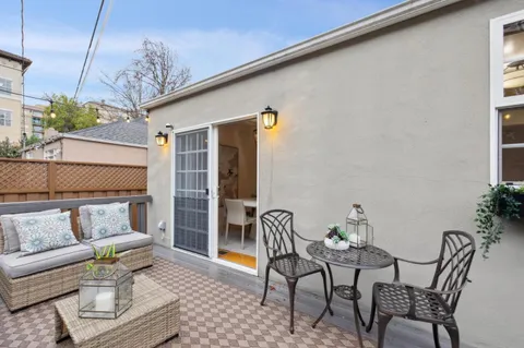 a view of a patio with couches and potted plants