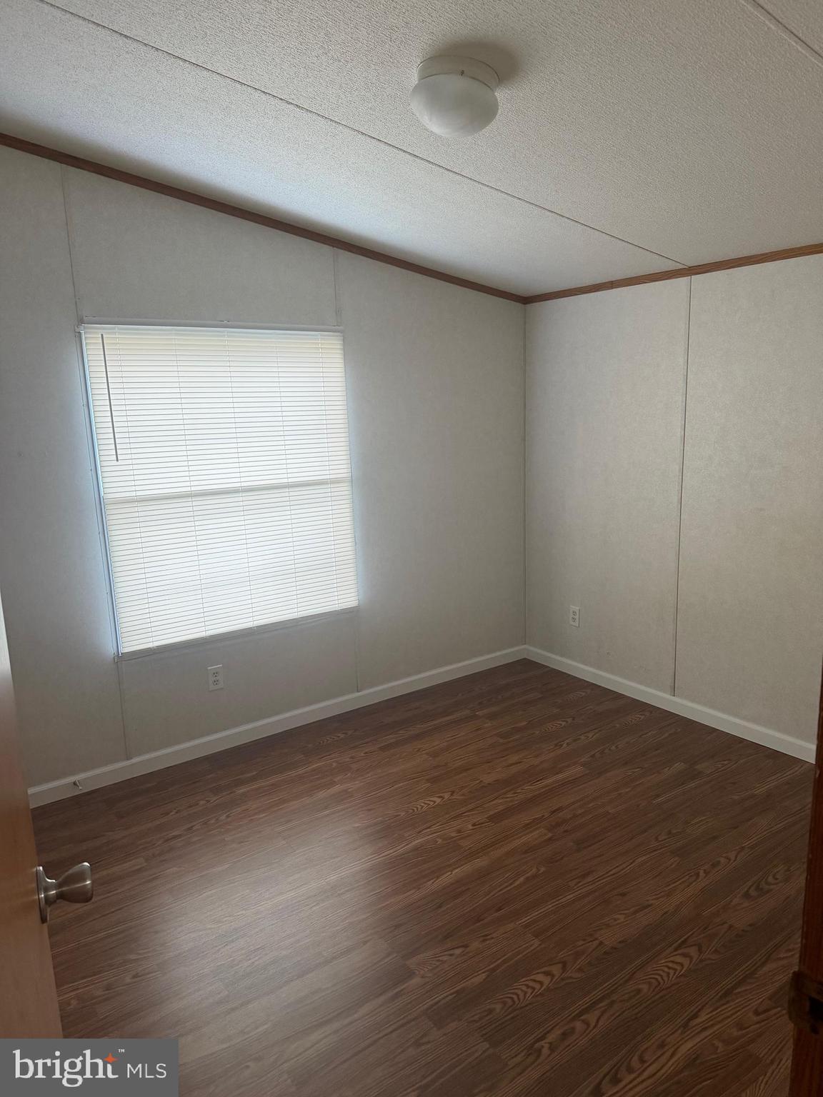 85 Cherokee Drive Windsor, PA 17366 - Photo 12 of 23 an empty room with wooden floor and windows