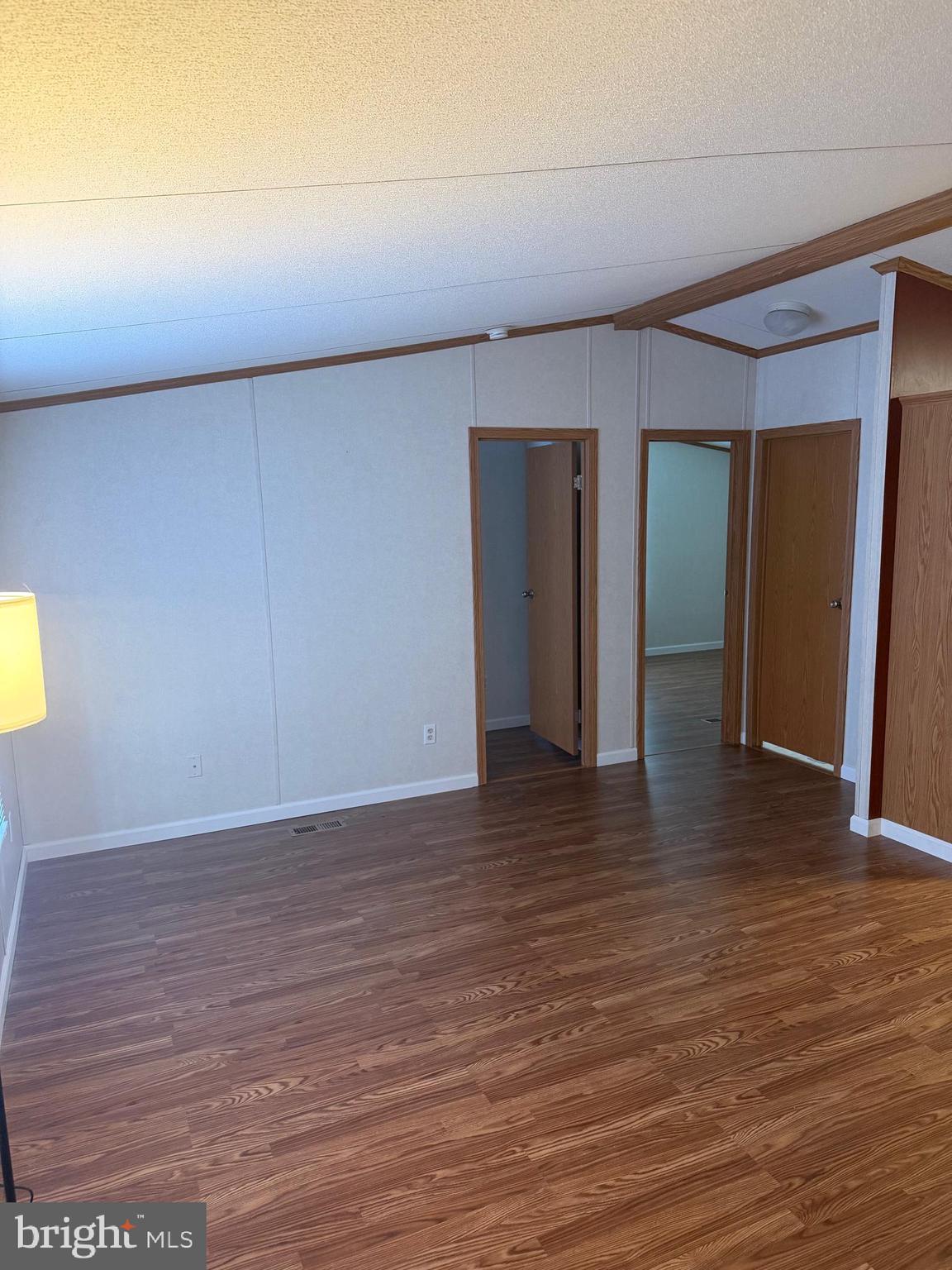 85 Cherokee Drive Windsor, PA 17366 - Photo 7 of 23 a view of an empty room with wooden floor and closet