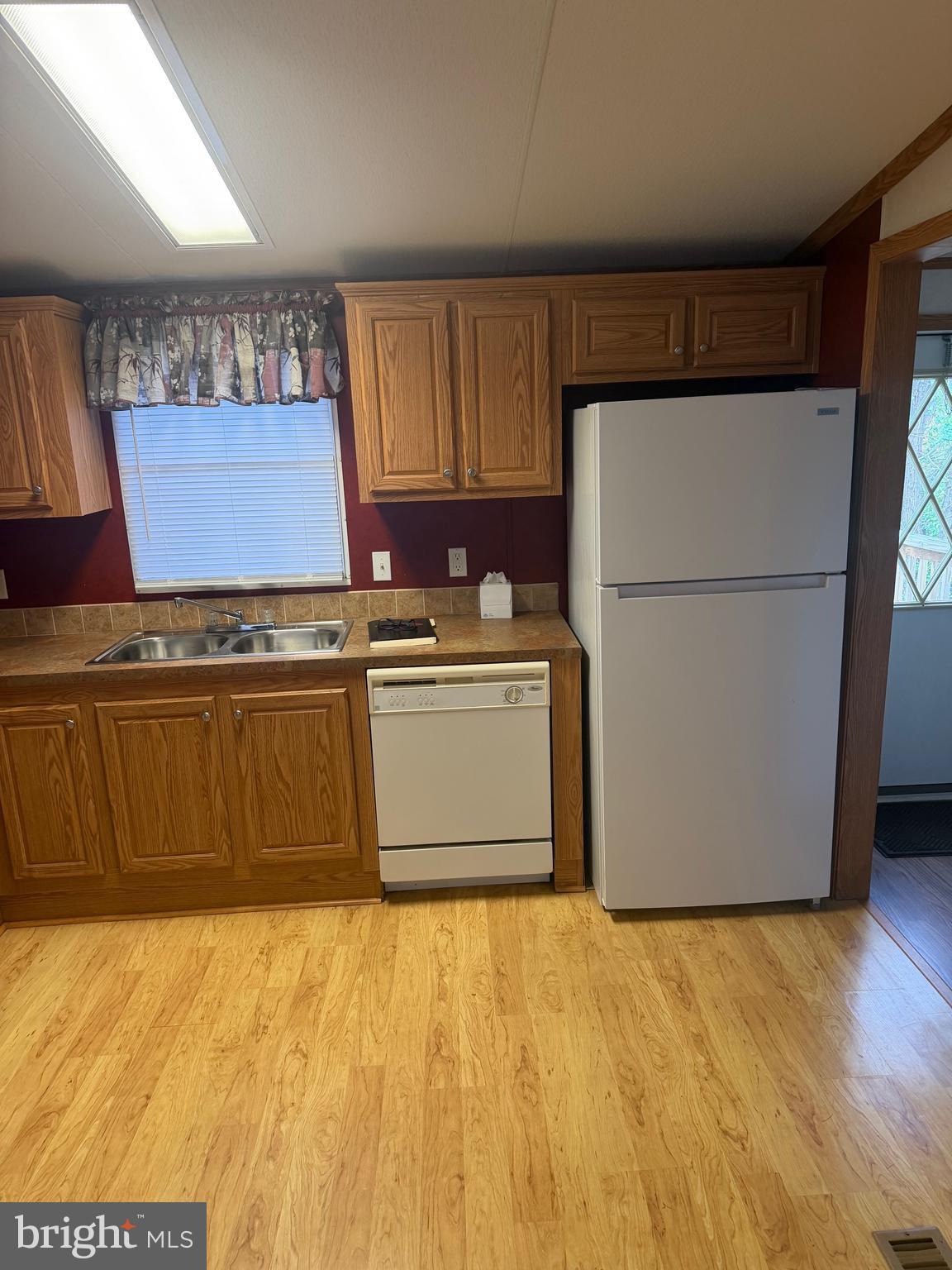 85 Cherokee Drive Windsor, PA 17366 - Photo 8 of 23 a kitchen with a stove top oven cabinets and a refrigerator