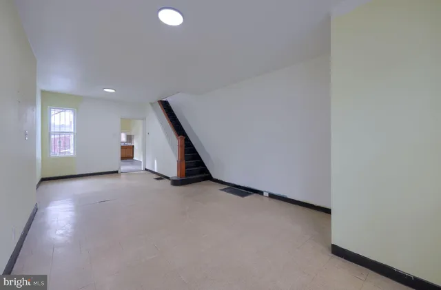 a view of an empty room with a window