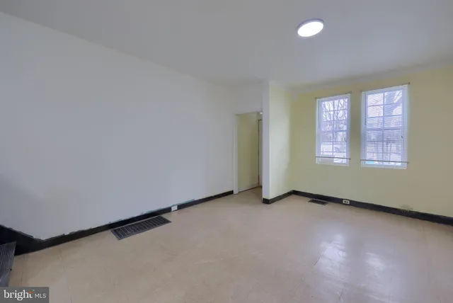 an empty room with windows