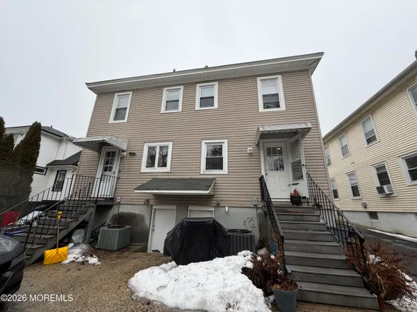 a front view of a house with glass windows