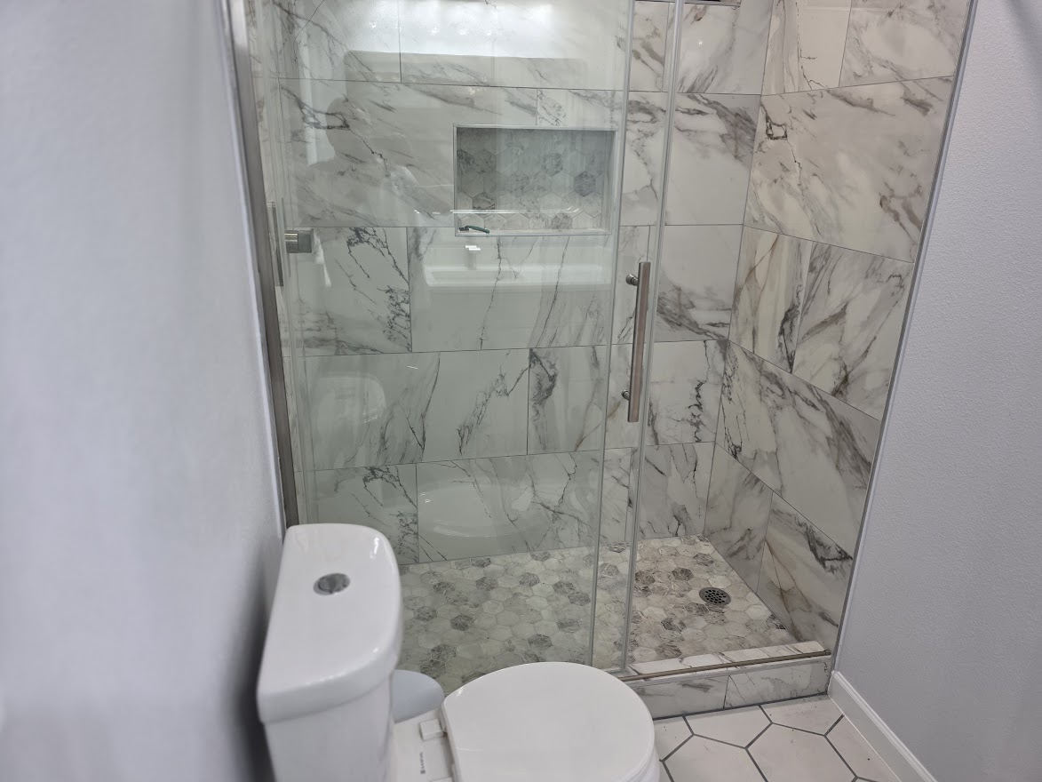 4803 Peach Grove Road Austin, TX 78744 - Photo 21 of 22 a bathroom with a toilet and a shower