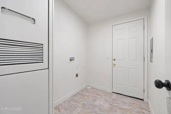 a view of a small space with wooden floor