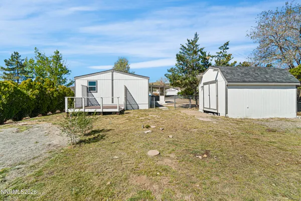 a view of a backyard of the house
